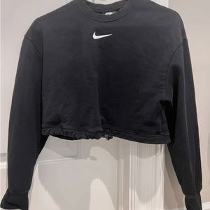 Cropped nike sweater logo on front and back of sweater with drawstring.